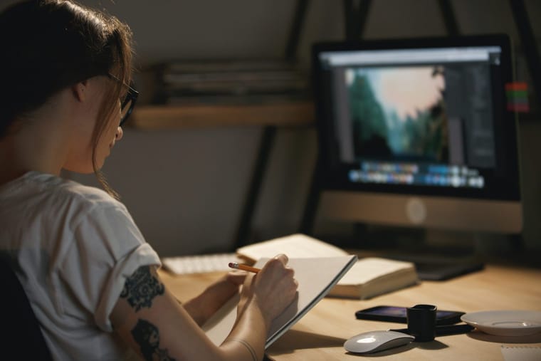 young-lady-designer-sitting-indoors-night-drawing-sketches-2048x1365.jpg